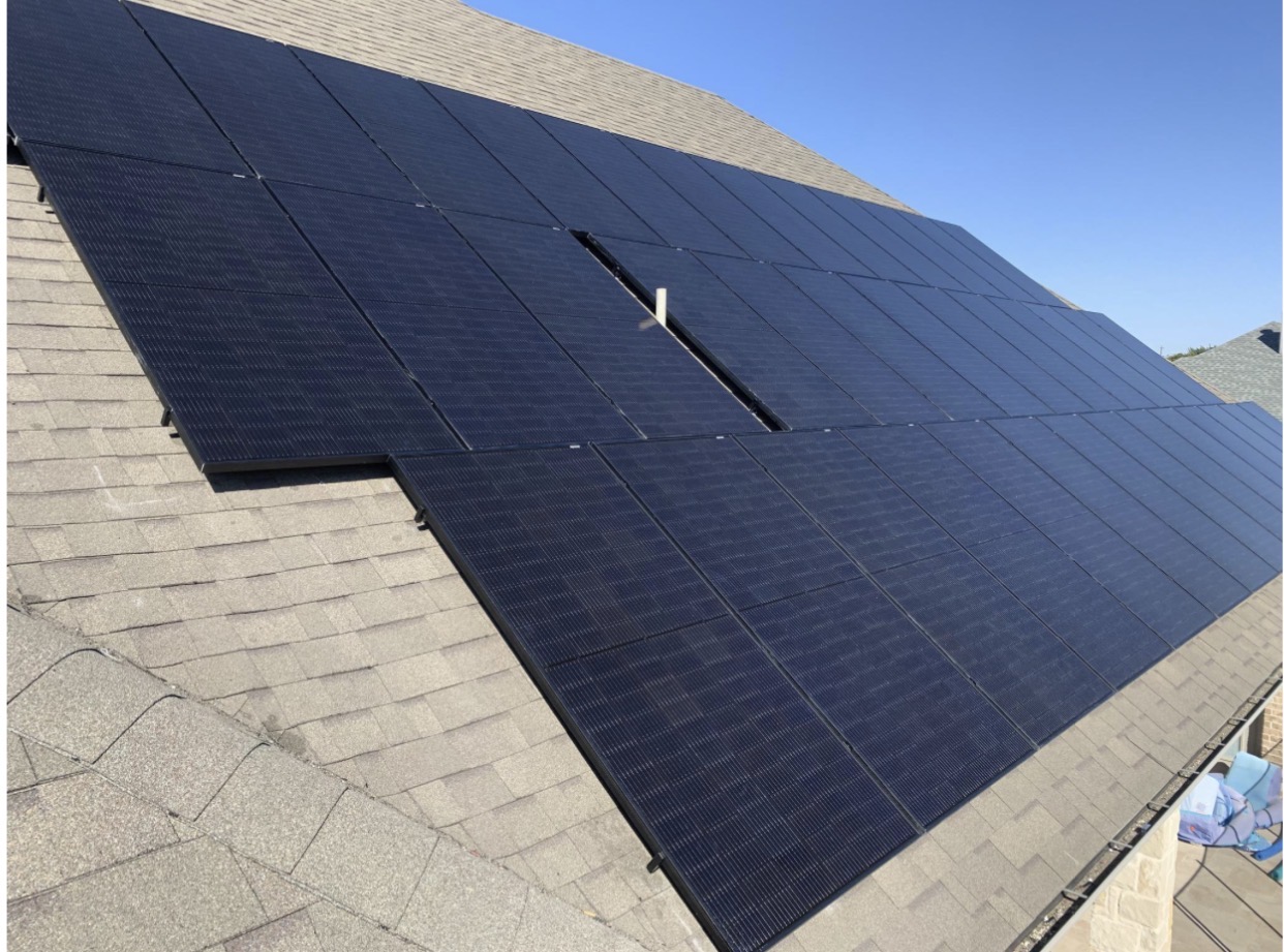 Finished rooftop solar array on asphalt shingles