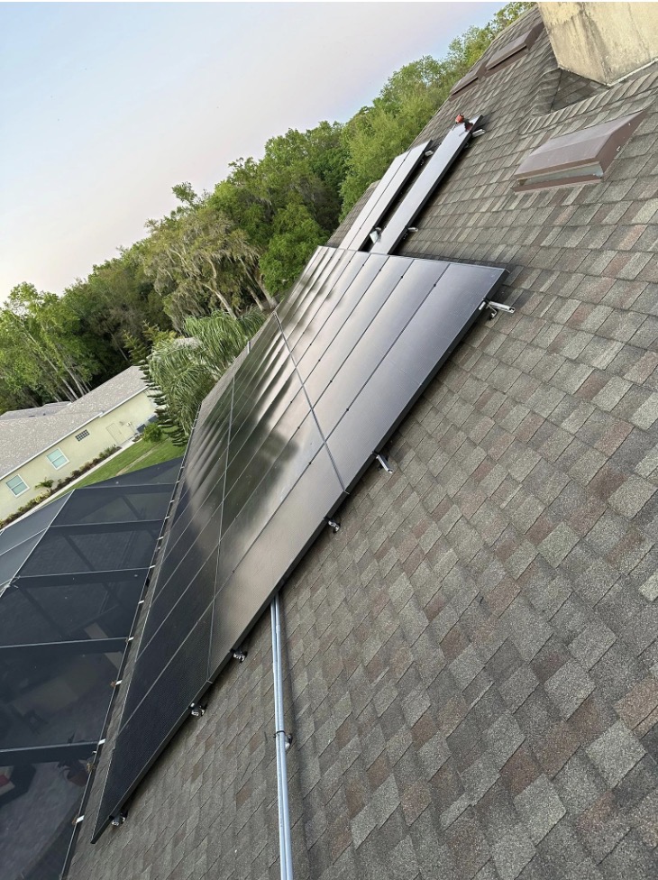 Rooftop solar beside a screened porch