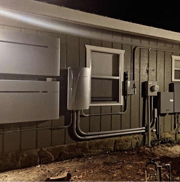 Wall batteries and inverter on a finished job